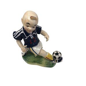 Vintage Ceramic Figurine Of Boy Playing Soccer In Navy Jersey